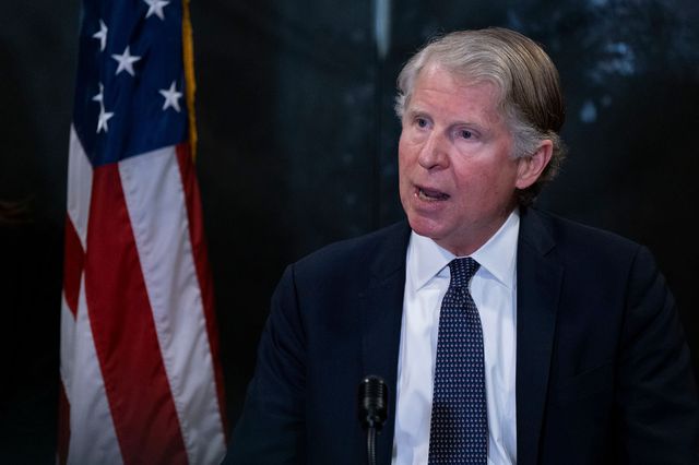 Cy Vance in a dark suit and dark tie with white dots